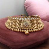 Luxurious gold-tone choker and maang tikka set with matching earrings